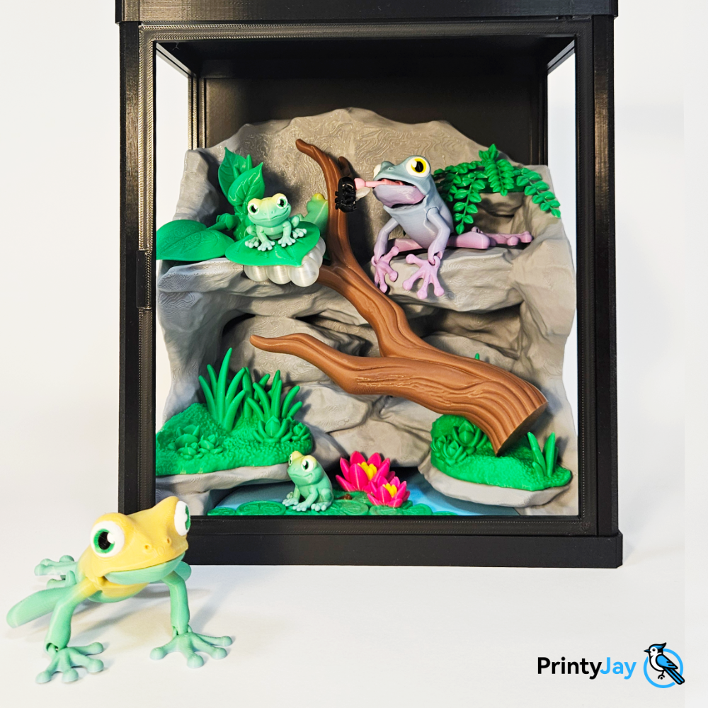 Tree frog terrarium diorama 3D print with frogs on rocks and branch catching a fly - PrintyJay